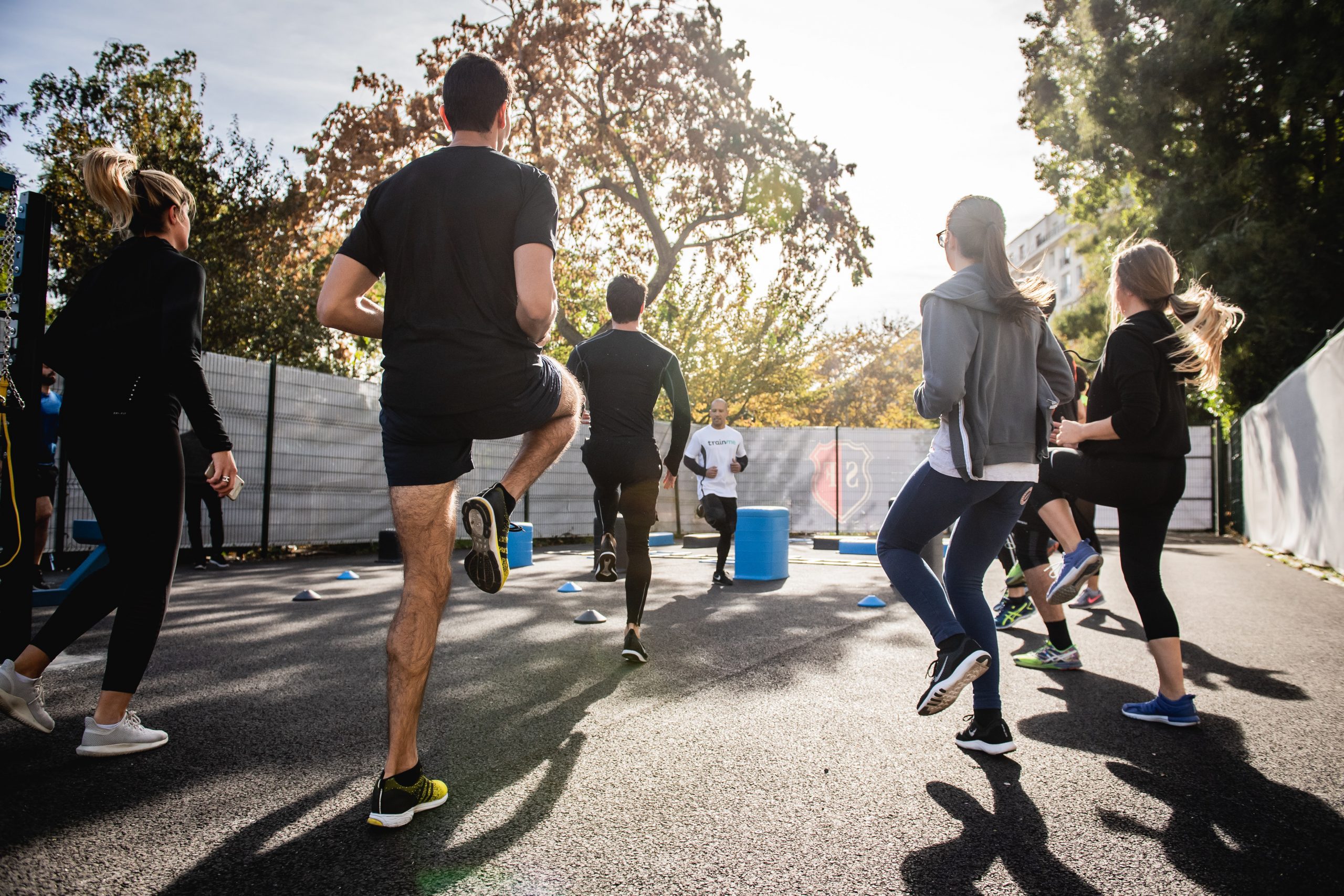 group of men and women exercising