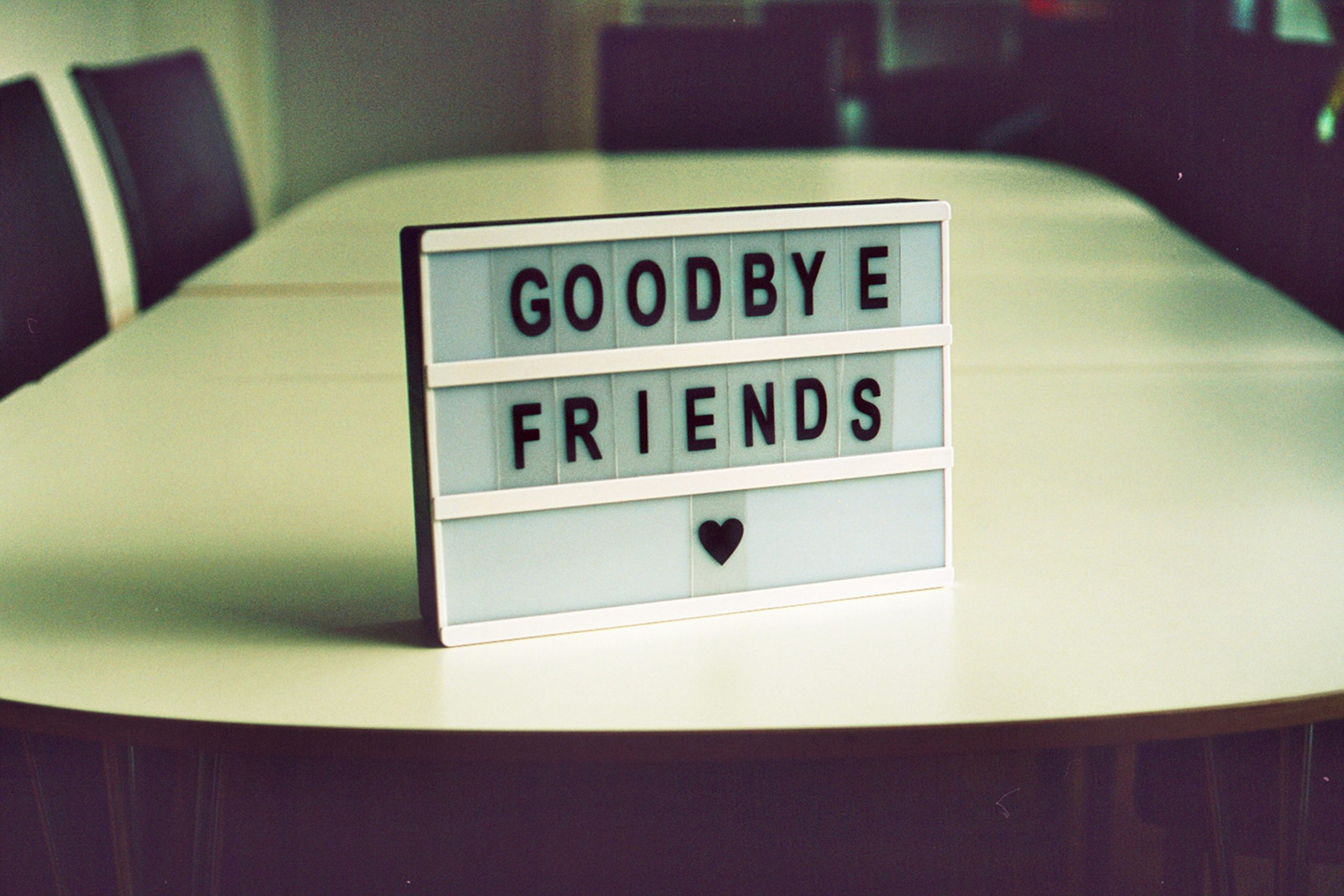 letter board on table with "Goodbye Friends"