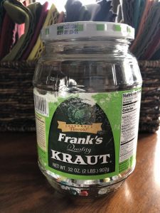 empty sauerkraut jar on a kitchen table