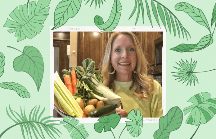 green leaves on green background with woman holding vegetables