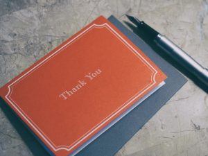 a thank you card with pen