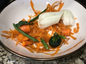 vegetable and herb scraps in a bowl