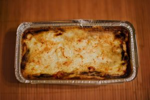 baked pasta in a tinfoil pan