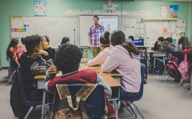 group of students with teacher in the classroom