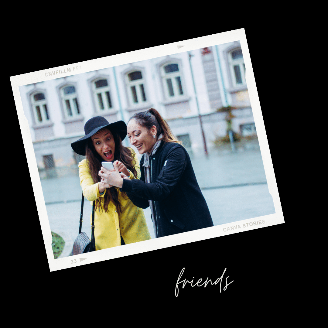 two female friends looking at a phone