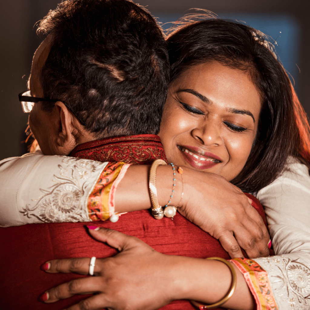 man and woman hugging goodbye