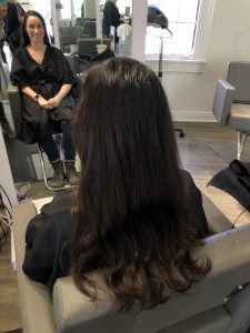 Alexandra at sitting in a hair salon waiting to get her hair done.