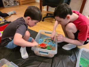 Sensory bin of kinetic sand