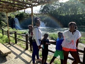 mother and kids at a waterfall