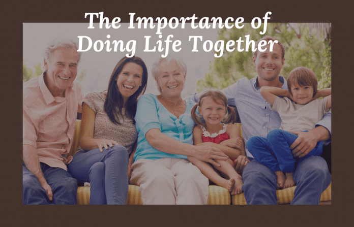 Multigenerational family portrait in grayscale with "The Important of Doing Life Together" in text