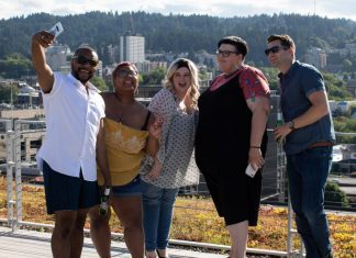 group of adults taking a selfie