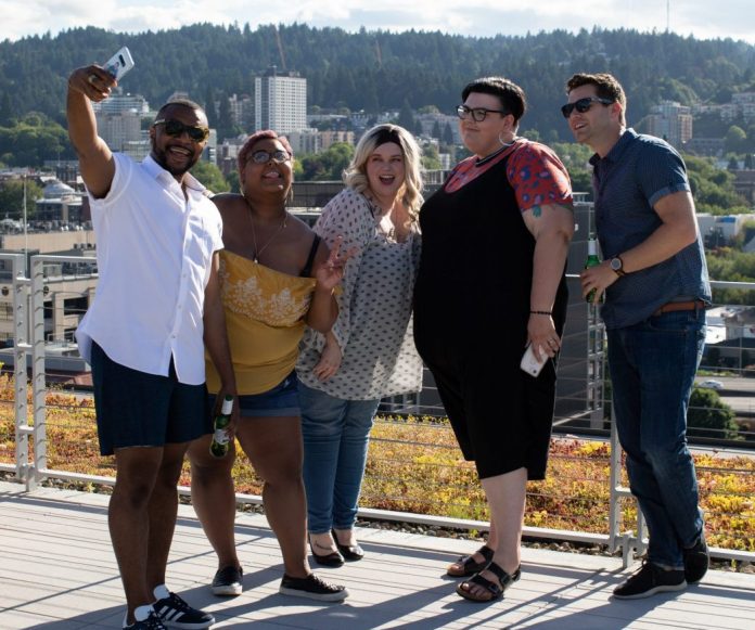 group of adults taking a selfie