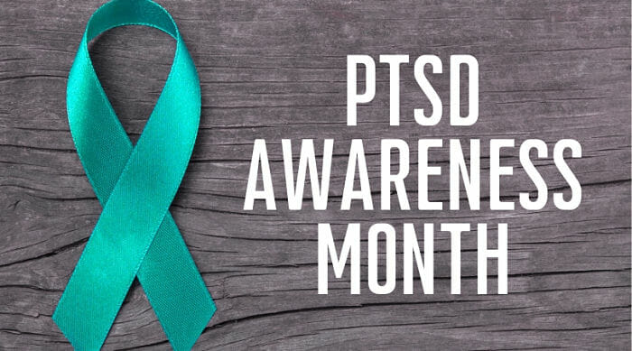 teal ribbon with "PTSD Awareness Month" in white text