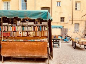 antique books on a cart in an Italian square