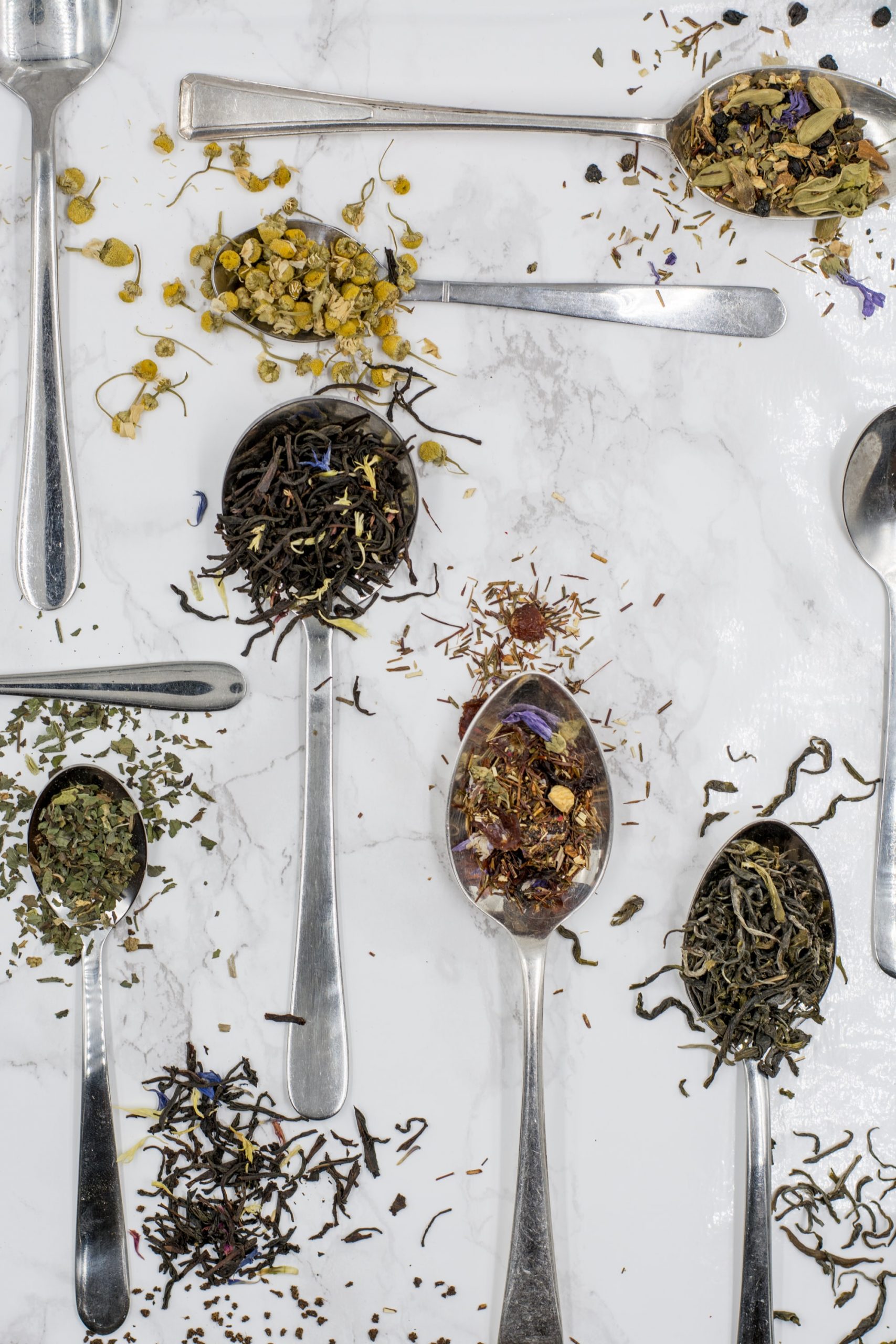 loose leaf tea leaves on spoons