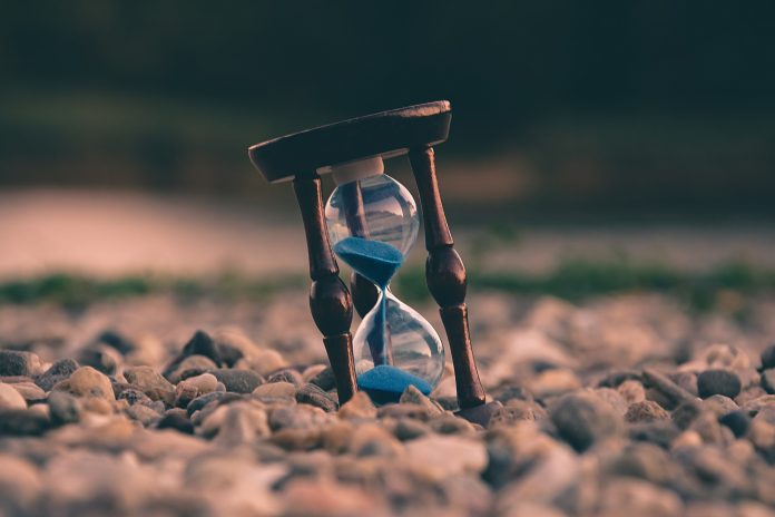 hourglass in pebbles to show time