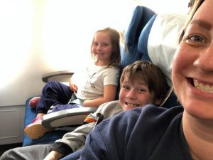 kids and mom on a flight