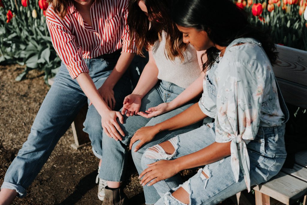 group of women sitting together in support