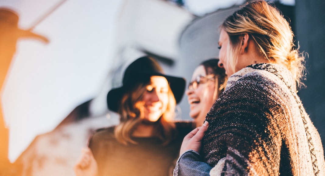 group of women friends laughing together