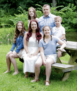 Rachel Carpenter and family outside