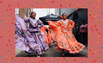 Hispanic dancers in traditional dress with a pale coral background and confetti