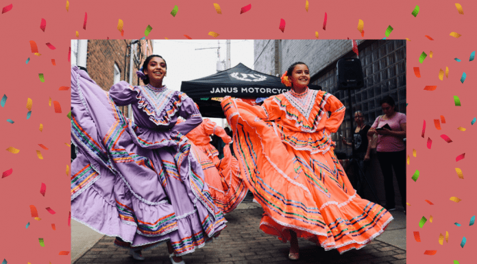 Hispanic dancers in traditional dress with a pale coral background and confetti