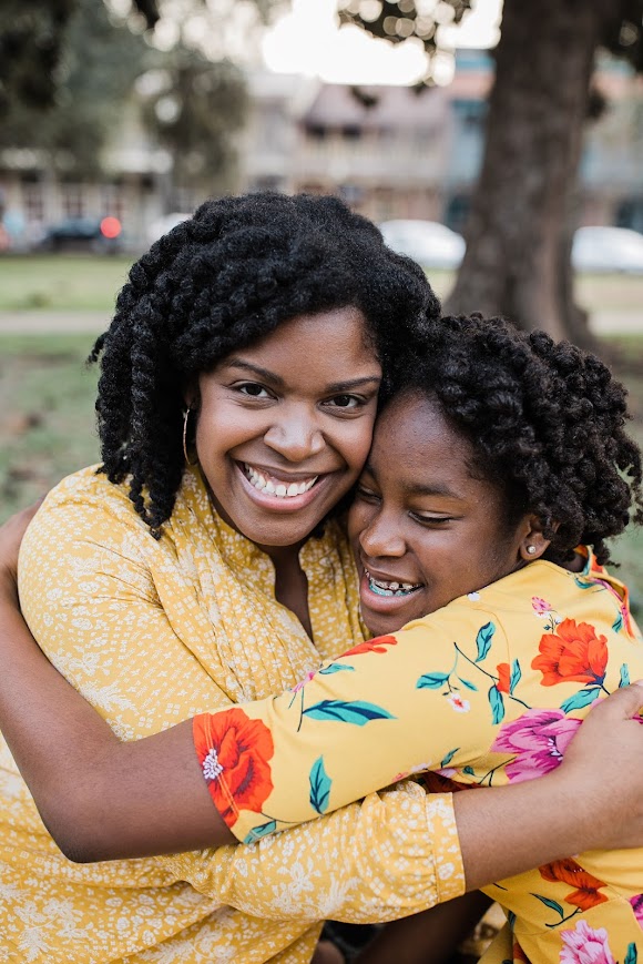 mom and daughter hugging