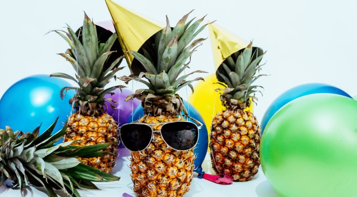 pineapples wearing sunglasses and beach balls