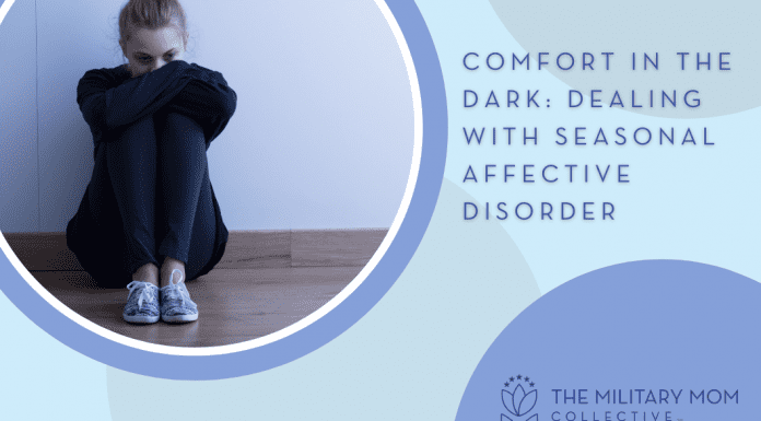Comfort in the Dark: Dealing with Seasonal Affective Disorder woman sitting in sadness with blue circles and "Comfort in the Dark: Dealing with Seasonal Affective Disorder" in text and MMC logo
