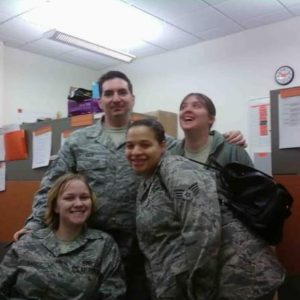 Diana Loader and active duty coworkers in Air Force uniform