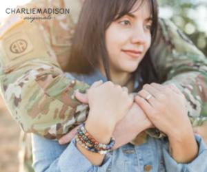 Charliemadison Originals bracelet on a woman with soldier hugging her