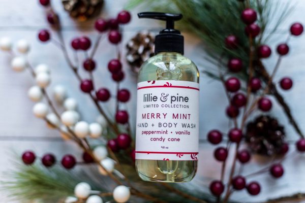 Lillie + Pine Merry Mint hand soap with holly berries and pine needles underneath