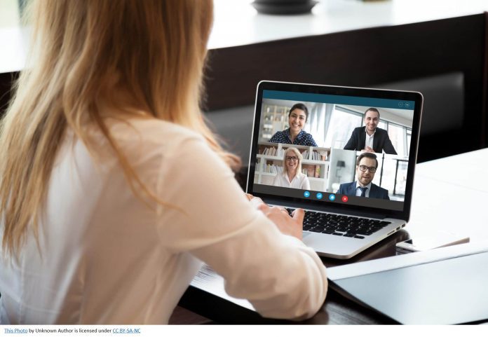 Woman working remote and in a virtual meeting