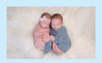 Lazy Mom’s Guide to Things You Actually Need When You Have Twins twin babies in pink and blue wraps on a white fluffy blanket