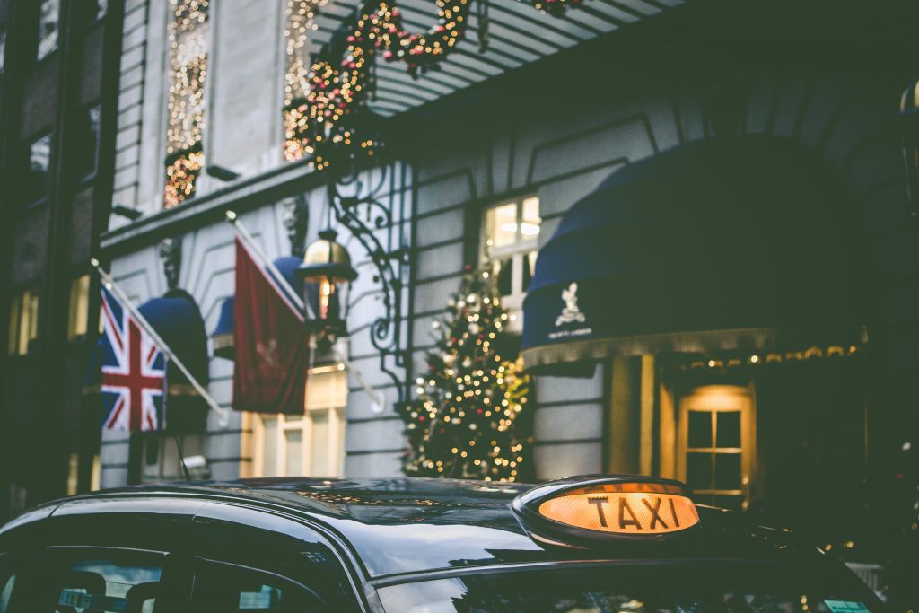 building with British flag on a London street during Christmas