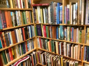 a packed bookshelf full of books