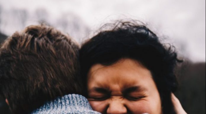 woman embracing a man with emotions