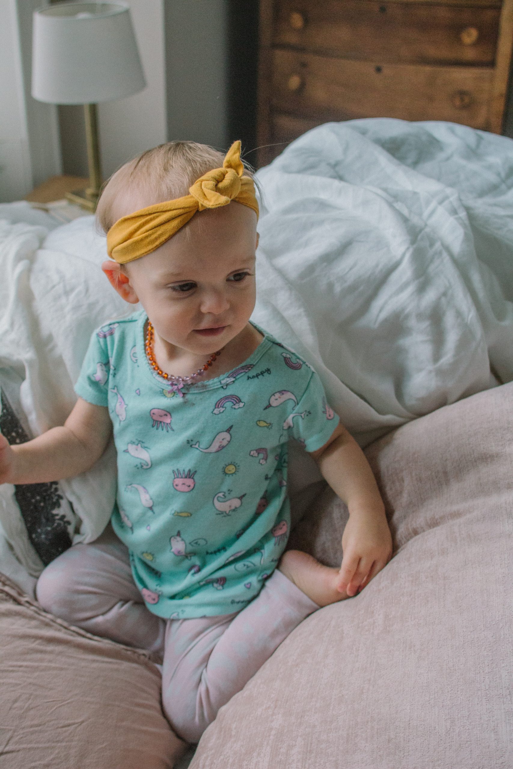 toddler girl in a bed