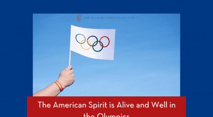 person holding a flag with the Olympic rings with "The American Spirit is Alive and Well in the Olympics" in text with MMC logo