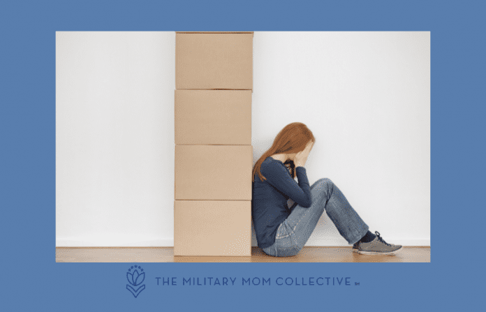 woman sitting with moving boxes, holding her head and looking overwhelmed, with MMC logo