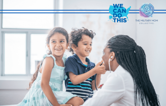 two Hispanic children with a Black female doctor in a brightly lit office with "We Can Do This" and MMC logos