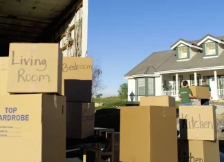 moving boxes outside a house on a sunny day