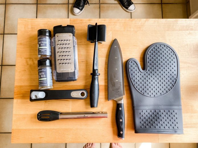 various kitchen tools on a butcher block