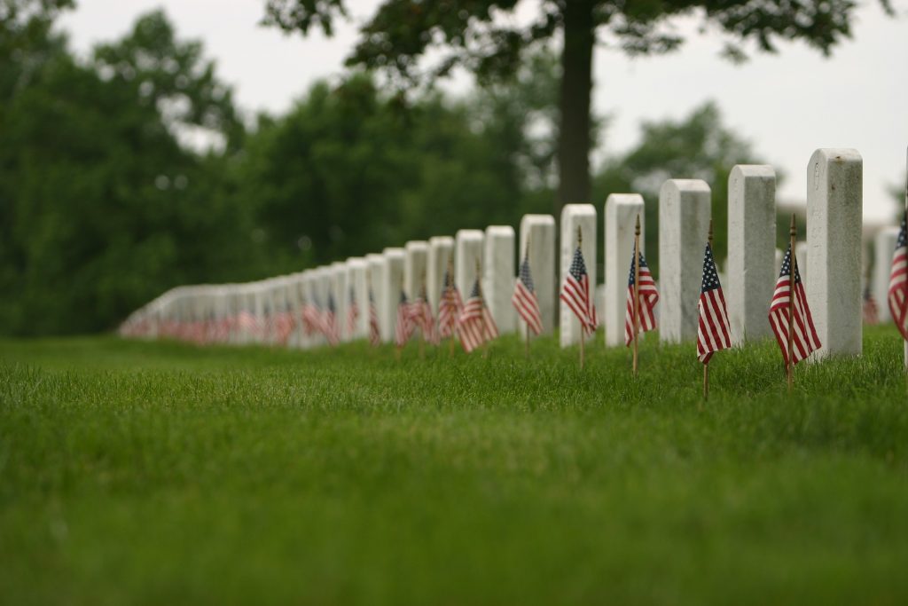 coins on a grave veterans day