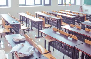 empty school classroom full of desks