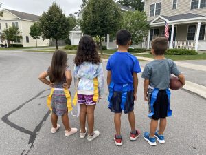 Kids wearing flags for football standing ready to play