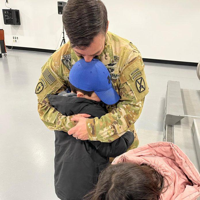 Child saying goodbye to father before deployment