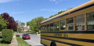 Keeping your independence during an overseas posting A yellow school bus is the main focus. It is pulling away on a residential street