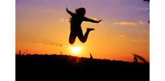 Person Jumping happily as the sun sets