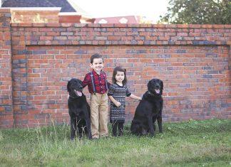 Children with black labs